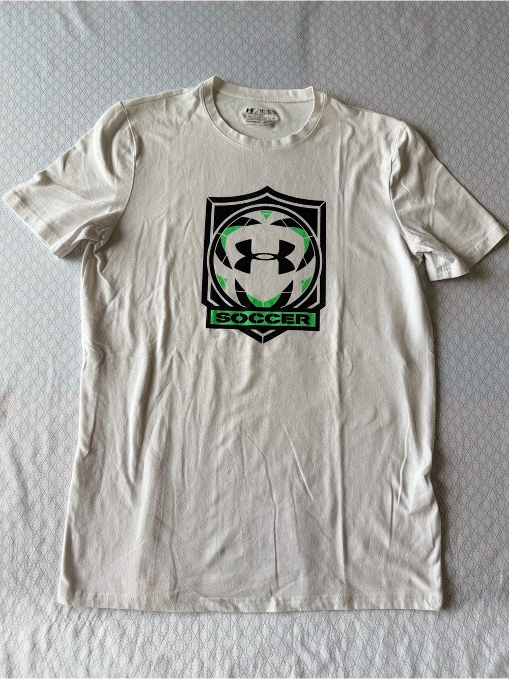 Under Armour White Short Sleeve Soccer Graphic Tee with Black & Green Logo